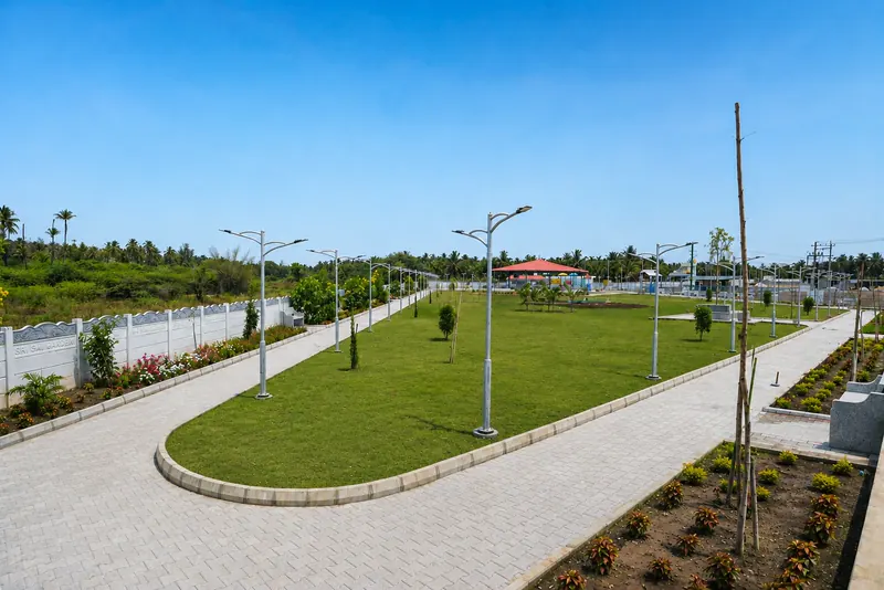 An oval lawn ringed by a paved walking track